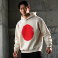 Model wearing Japan brushstrokes boxy hoodie, streetwear lookbook shot