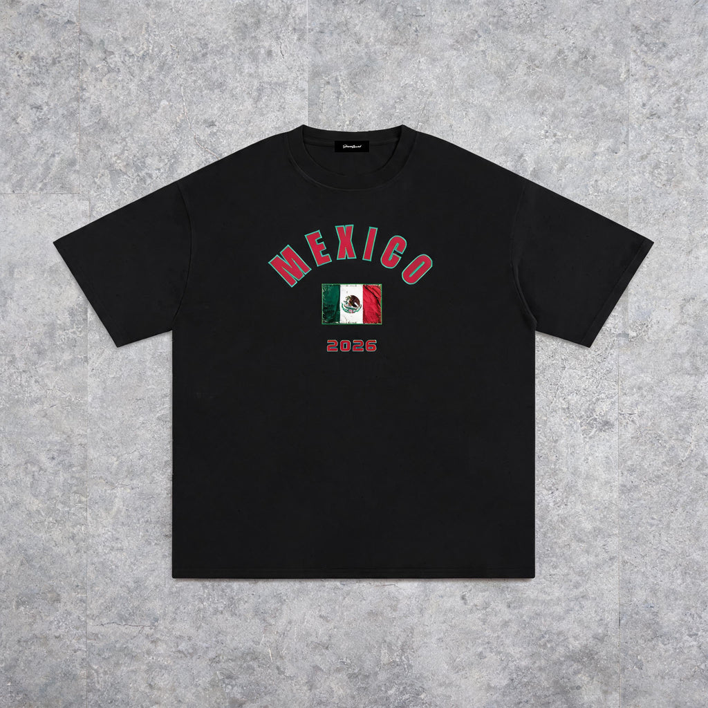 Mexico 2026 unisex cotton tee on model — front view, slate studio background