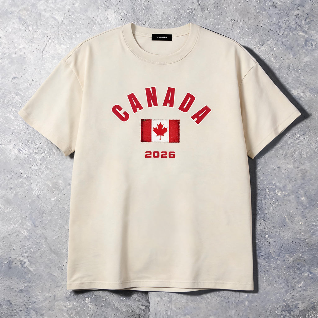 Canada 2026 unisex cotton tee on model — front view, slate studio background