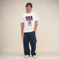 Retro USA Soccer Unisex Pure Cotton T-Shirt — studio model lifestyle
